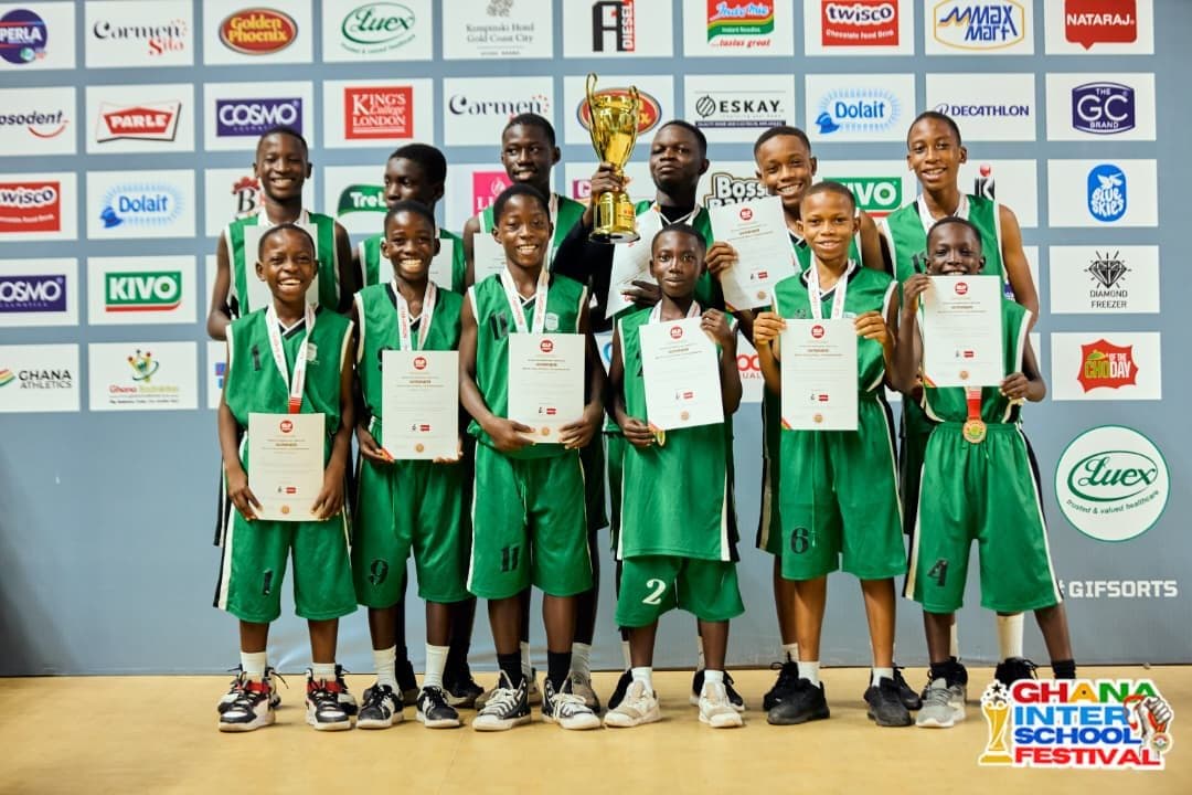Richesther basketball team holding their championship trophy and certificates