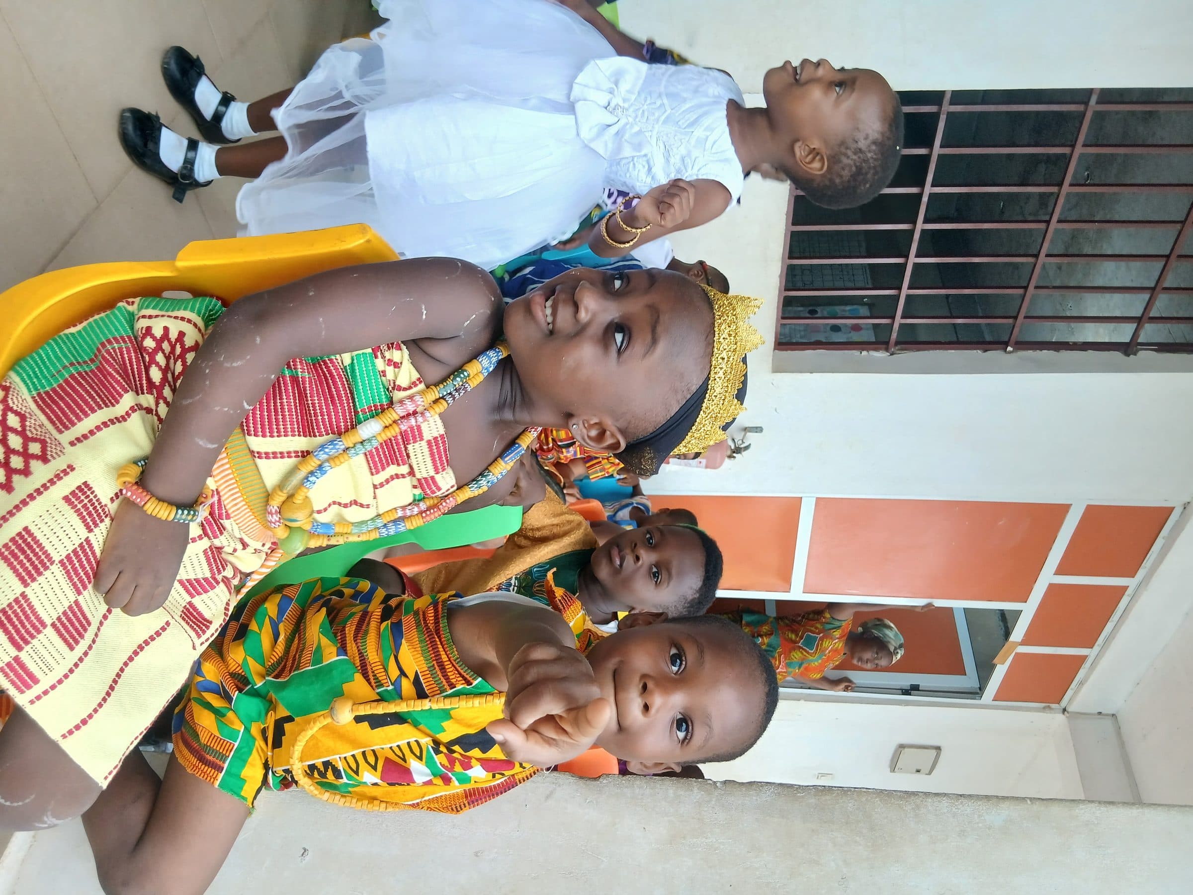 Children dressed in traditional kente for cultural day